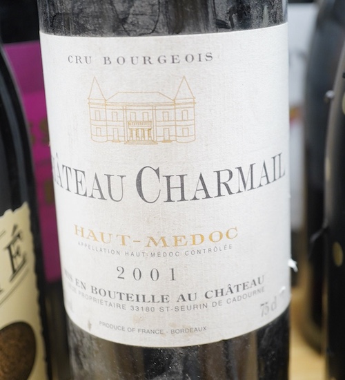 Twelve bottles of wine including; three bottles of Chateau Charmail 2001, a bottle of Chateauneuf-du-Pape 2001, a Cabalie 2022, a Brass Monkey 2019 Shiraz, Prosecco, etc. Condition - fair to good.